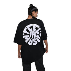 Feel the music T-Shirt: Black, Oversized, Back Model Pose, Bio-Washed Cotton Printed by Techno Be With You
