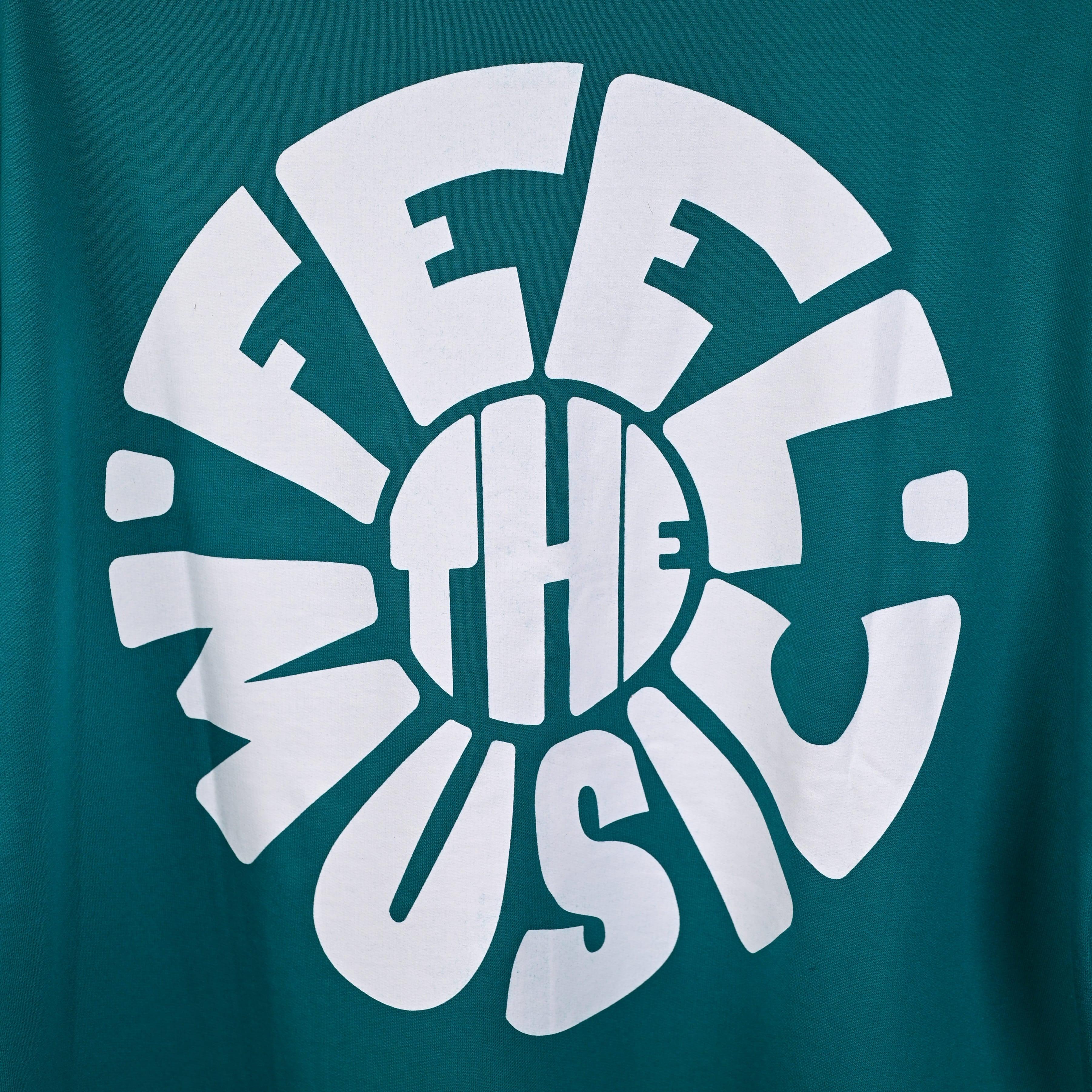 Feel the music T-Shirt: Light Blue, Oversized, Close Front side Logo, Bio-Washed Cotton Printed by Techno Be With You