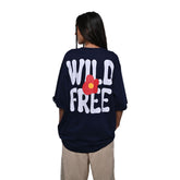 Wild Free T-Shirt: Black, Oversized, Back Model Pose, Bio-Washed Cotton Printed by Techno Be With You