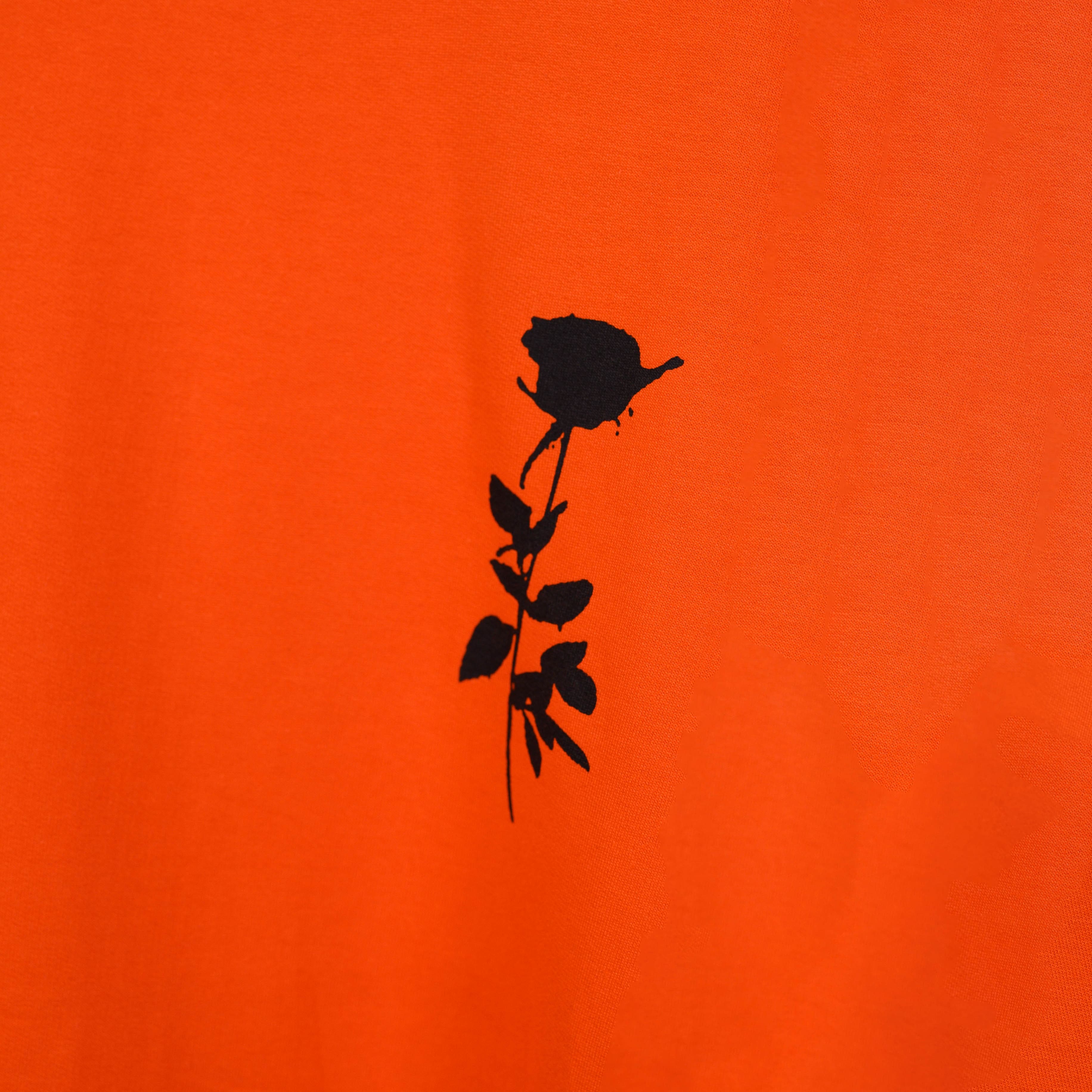 Oversized orange t-shirt with Afterthought style print on the front side close look