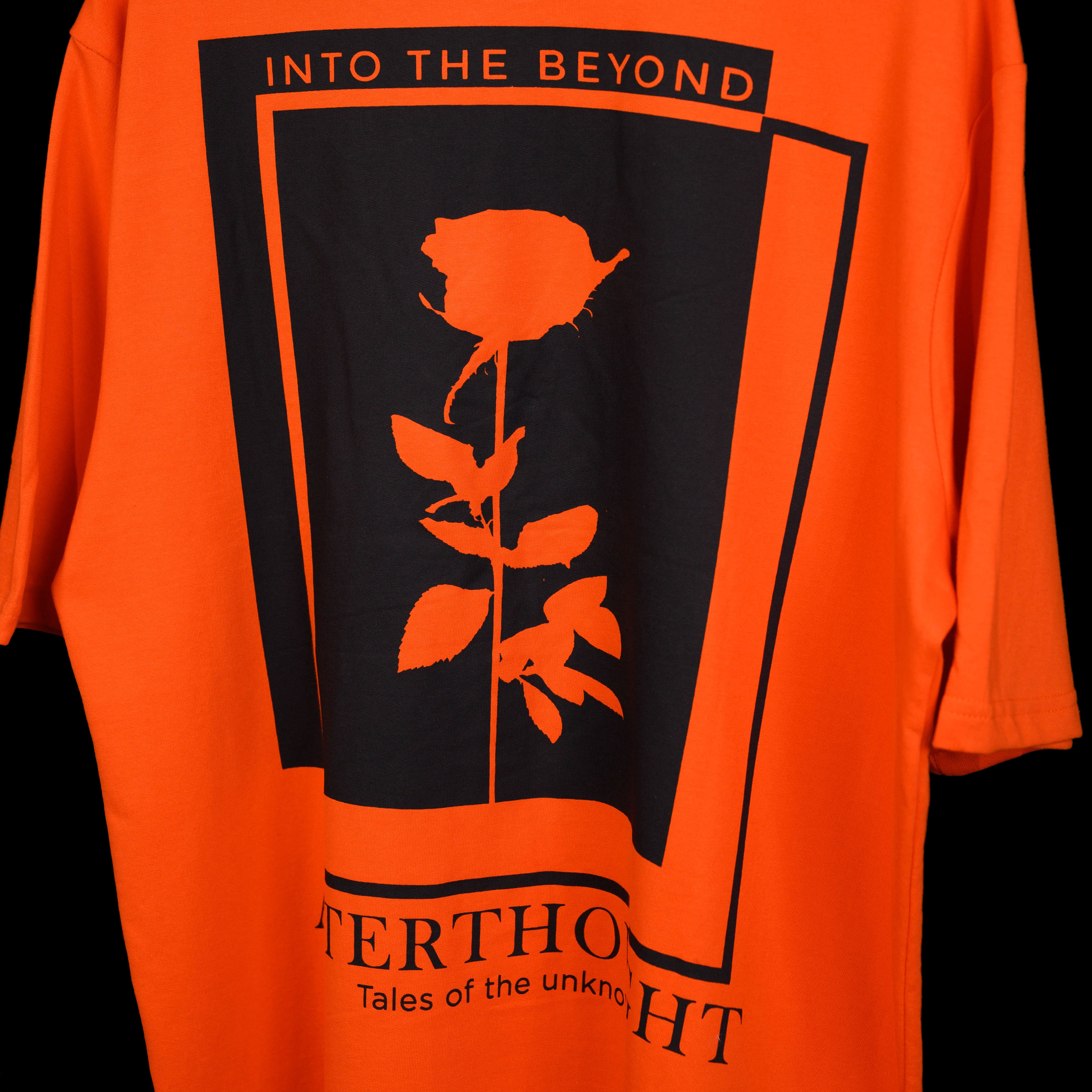 Oversized orange t-shirt with Afterthought style print on the back side close look